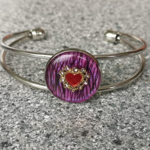 Ring mit kleinem roten Herz